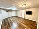 Finished basement with wood-look floors, recessed lighting, and neutral paint at 2515 Little John Ct, Cumming, GA 30040