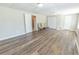 Large basement with wood-look flooring and multiple doors perfect for entertaining and storage at 2515 Little John Ct, Cumming, GA 30040