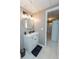 Basement bathroom features stylish vanity, framed mirror, and tiled floor at 2515 Little John Ct, Cumming, GA 30040
