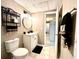 Bathroom with a toilet, tiled floor, and a white vanity with black hardware at 2515 Little John Ct, Cumming, GA 30040