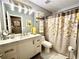 Well-lit bathroom features marble floors, granite countertop, and modern vanity lighting at 2515 Little John Ct, Cumming, GA 30040