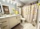 Charming bathroom with marble floors, granite countertops, and modern fixtures at 2515 Little John Ct, Cumming, GA 30040