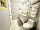 Compact bathroom features marble floors, granite countertop, and updated vanity at 2515 Little John Ct, Cumming, GA 30040