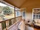 Relaxing covered deck area with views of the landscaped backyard at 2515 Little John Ct, Cumming, GA 30040
