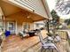Inviting outdoor deck with comfortable seating and a ceiling fan for relaxing evenings at 2515 Little John Ct, Cumming, GA 30040