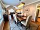 Stylish dining area with modern lighting, seating for six, and hardwood floors at 2515 Little John Ct, Cumming, GA 30040