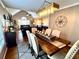 Bright dining room with high ceilings and a view into the adjacent living room at 2515 Little John Ct, Cumming, GA 30040