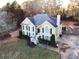 Traditional two-story home boasts mature landscaping, large windows, and a welcoming entrance at 2515 Little John Ct, Cumming, GA 30040
