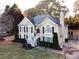 Charming two-story home with a landscaped front yard and welcoming white staircase at 2515 Little John Ct, Cumming, GA 30040