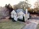 Traditional two-story home with a well-manicured lawn and a cozy front porch at 2515 Little John Ct, Cumming, GA 30040