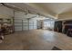 Spacious two-car garage providing ample storage with built-in shelving and a window for natural light at 2515 Little John Ct, Cumming, GA 30040