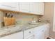 Well-designed kitchen features granite countertops, stainless steel appliances, and ample cabinet space at 2515 Little John Ct, Cumming, GA 30040
