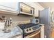 Stainless steel appliances and granite countertops add elegance to this well-appointed kitchen at 2515 Little John Ct, Cumming, GA 30040