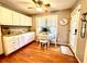 Bright kitchen nook featuring hardwood floors, a breakfast table, and natural lighting at 2515 Little John Ct, Cumming, GA 30040