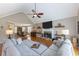 Inviting living room featuring a fireplace, vaulted ceilings, and hardwood floors at 2515 Little John Ct, Cumming, GA 30040