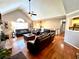 Bright living room with hardwood floors, fireplace, and access to the adjacent dining room at 2515 Little John Ct, Cumming, GA 30040