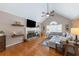 Comfortable living room with a stone fireplace, hardwood floors, vaulted ceiling, and stylish decor at 2515 Little John Ct, Cumming, GA 30040