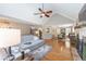 Open-concept living room showcasing seamless flow into the dining area and abundant natural light at 2515 Little John Ct, Cumming, GA 30040
