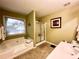 This main bathroom boasts a tub with jets, a tub/shower combo, and a separate sink at 2515 Little John Ct, Cumming, GA 30040