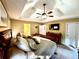 This main bedroom features a trey ceiling, ceiling fan, and a wall mounted television at 2515 Little John Ct, Cumming, GA 30040