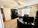 Well-lit home office with built-in shelving, dual monitors, and carpet floors at 2515 Little John Ct, Cumming, GA 30040