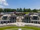 Town center showcasing restaurants, shops, and outdoor seating areas, fostering a vibrant community atmosphere at 2515 Little John Ct, Cumming, GA 30040