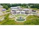 An aerial view of the town center featuring a mini-golf area, amphitheater, shops and restaurants at 2515 Little John Ct, Cumming, GA 30040