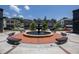 Town center view with fountain, benches, and shops, creating a gathering space at 2515 Little John Ct, Cumming, GA 30040