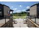 Outdoor town center view features an amphitheater, brick buildings, black iron railings, and cafe string lights at 2515 Little John Ct, Cumming, GA 30040
