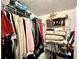 This functional walk-in closet features hanging racks, shelves, and storage for all your wardrobe needs at 2515 Little John Ct, Cumming, GA 30040