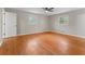 This is a spacious bedroom featuring hardwood floors, neutral walls, and a ceiling fan at 2002 Twin Falls Rd, Decatur, GA 30032