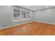 Bright living room with refinished hardwood floors, fresh gray paint, and lots of natural light at 2002 Twin Falls Rd, Decatur, GA 30032