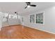 Large living room featuring hardwood floors, stairs and plenty of natural light at 2002 Twin Falls Rd, Decatur, GA 30032