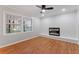 Living room featuring hardwood floors, brick fireplace and window views at 2002 Twin Falls Rd, Decatur, GA 30032