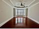 Spacious bedroom with hardwood floors, large windows, and a ceiling fan for added comfort at 2822 Salem Oak Way, Duluth, GA 30096