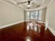 Spacious bedroom with hardwood floors, tray ceiling, ceiling fan and large bay window offers plenty of natural light at 2822 Salem Oak Way, Duluth, GA 30096