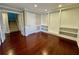 Open floor plan, bonus room with hardwood floors and custom built-ins at 2822 Salem Oak Way, Duluth, GA 30096