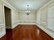 Elegant dining room featuring hardwood floors, chair rail, and modern chandelier at 2822 Salem Oak Way, Duluth, GA 30096