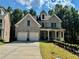 Charming two-story brick home featuring a two-car garage and inviting front porch at 2822 Salem Oak Way, Duluth, GA 30096