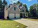 Beautiful two-story brick home with a two-car garage and well-maintained lawn at 2822 Salem Oak Way, Duluth, GA 30096