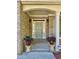 Inviting front entrance with brick porch, flanked by planters and classic door at 2822 Salem Oak Way, Duluth, GA 30096