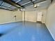 Spacious garage featuring painted flooring and ample ceiling storage at 2822 Salem Oak Way, Duluth, GA 30096