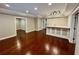 Living room with bar, hardwood floors, and ample space for entertaining guests at 2822 Salem Oak Way, Duluth, GA 30096