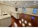 Open living room with gleaming hardwood floors, a wet bar and lots of natural light at 2822 Salem Oak Way, Duluth, GA 30096