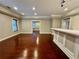 Hardwood flooring and the wet bar highlight the open floor plan of the living room at 2822 Salem Oak Way, Duluth, GA 30096