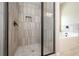 Tiled shower with a glass door next to a bright white soaking tub at 5995 Crowley Dr, Douglasville, GA 30135