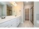 Bright bathroom features a double vanity, a large mirror, and a walk-in closet at 5995 Crowley Dr, Douglasville, GA 30135