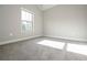 Carpeted bedroom with window letting in light at 5995 Crowley Dr, Douglasville, GA 30135