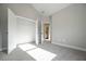 Carpeted bedroom with walk in closet and ensuite bathroom at 5995 Crowley Dr, Douglasville, GA 30135