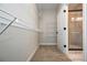 Walk-in closet with wire shelving for maximum storage, leading to bathroom at 5995 Crowley Dr, Douglasville, GA 30135
